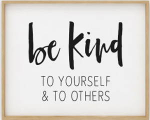 Image of a wall hanging that says: be kind to yourself and to others"